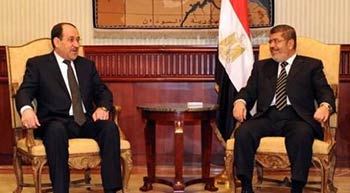 مرسي والمالكي في اجتماع على هامش قمة مؤتمر منظمة المؤتمر الإسلامي بغداد والقاهرة .. الاقتصاد هو المفتاح!