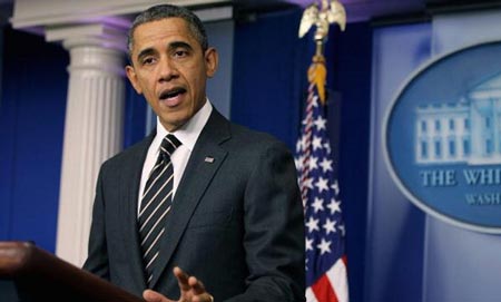 أوباما يوقع على قرار بتخفيض الميزانية