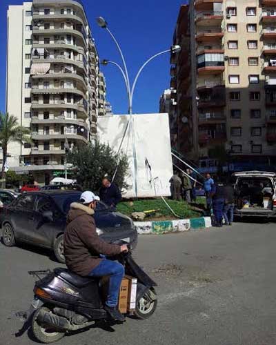 بيروت ومختلف المناطق تنزع عنها الصور والاعلام واللافتات الحزبية