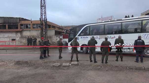 انتهاء عملية خروج الدفعة الاولى من المسلحين من حي الوعر في حمص 