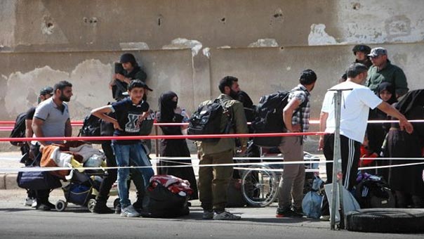 تناقص أعداد الرافضين لاتفاق المصالحة بعد خروج 260 مسلحا من حي الوعر في حمص