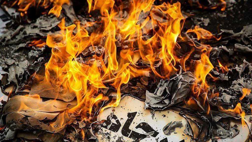 ردًا على ترامب.. إحراق نصّ الاتفاق النووي في مجلس الشورى الإيراني