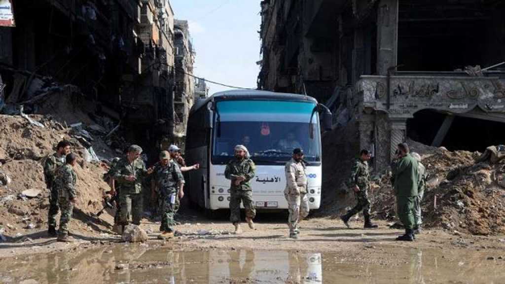 آلاف المسلحين يغادرون مخيم اليرموك