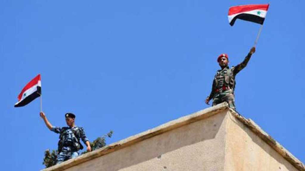 رفع العلم السوري فوق المباني الحكومية في الحولة بريف حمص