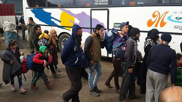 خروج دفعة جديدة من مسلحي حي الوعر في حمص تمهيدًا لإعادته إلى حضن الدولة